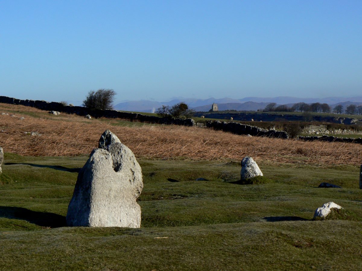 Druids Temple with a view past the Bardsea monument to the Lake District Peaks